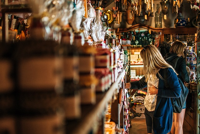 Woman browsing the shelves in a retail store.