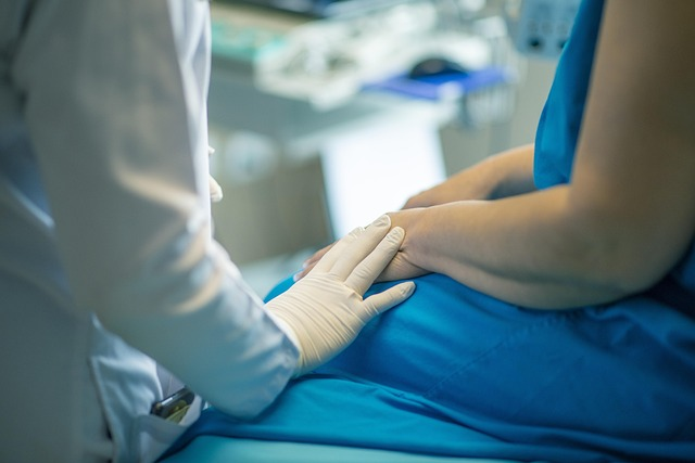 A healthcare professional is attending to a patient.